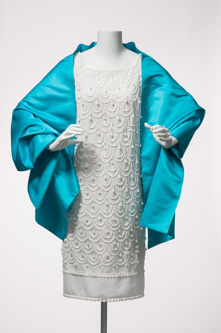 An elegantly detailed cocktail dress and wrap by Gwen Gillam.